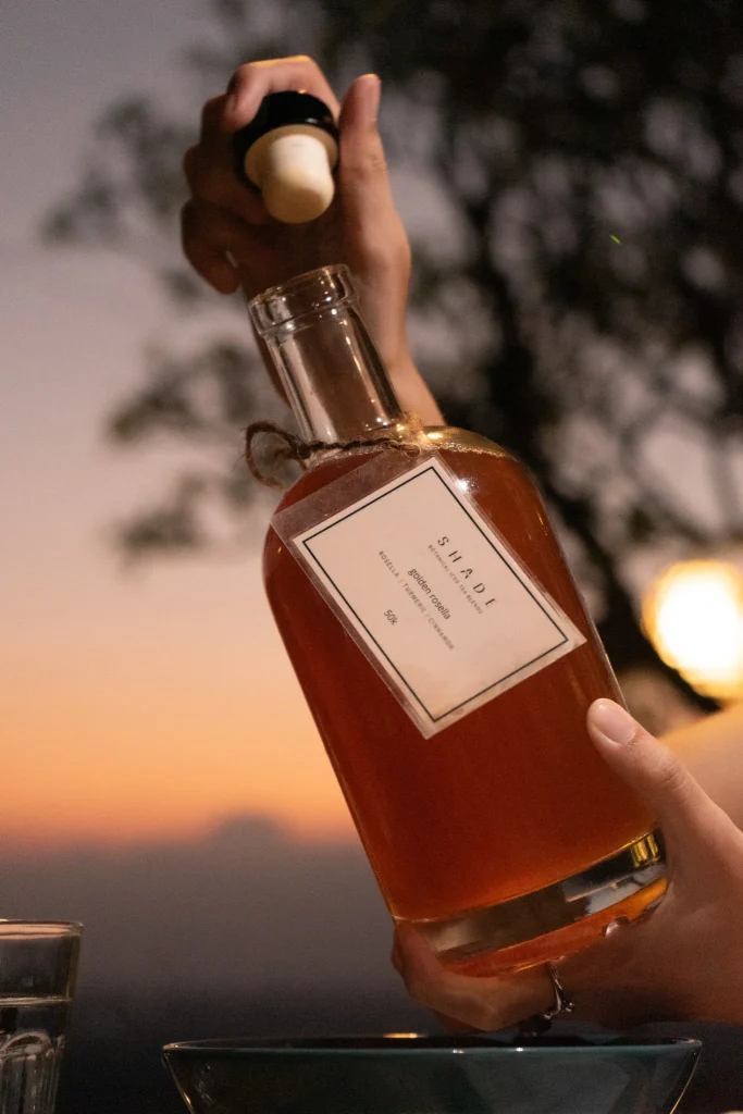 SHADE_Botanicals_-_Drinking_Lifestyle_-_Iced_Tea_Bottle_-_Golden_Rosella_Variant